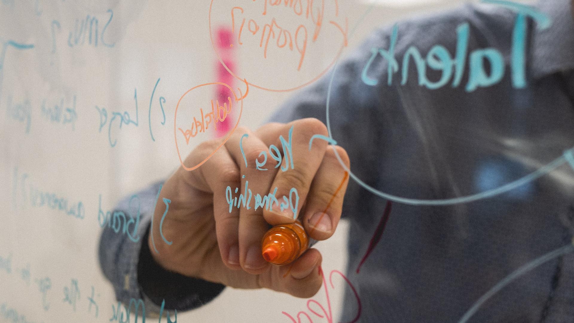 person holding orange flower petals